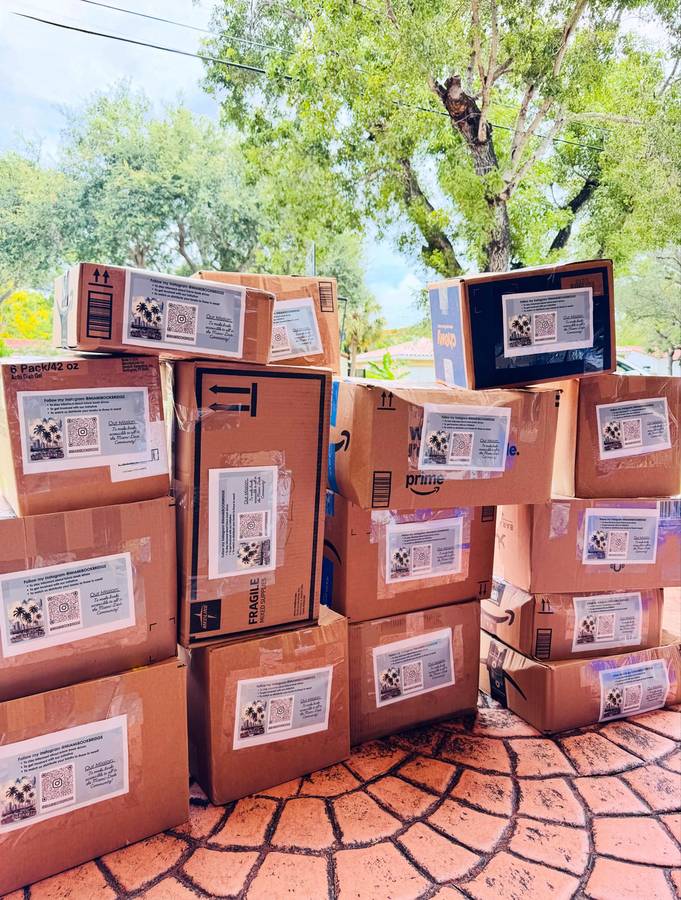 Stack of labeled boxes of children’s books bound for The Bahamas