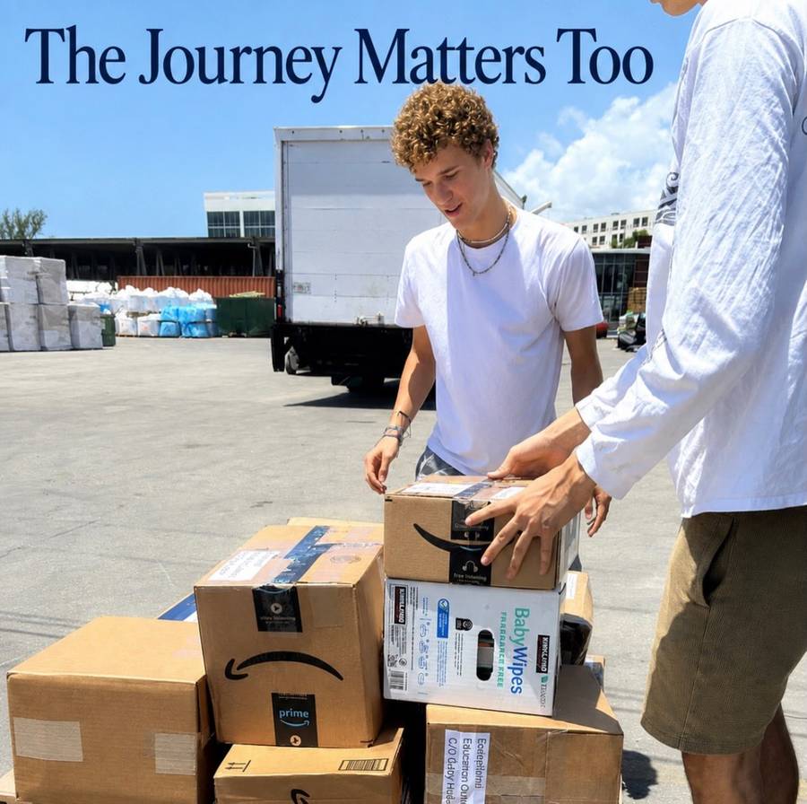 Two people loading boxes of donated books for shipping